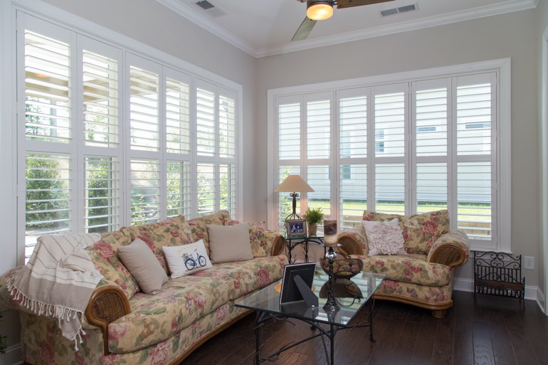 Airy sunroom with interior shutters in Washington DC.